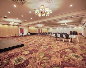 Meeting room with classroom-style seating at Amenida Residences.