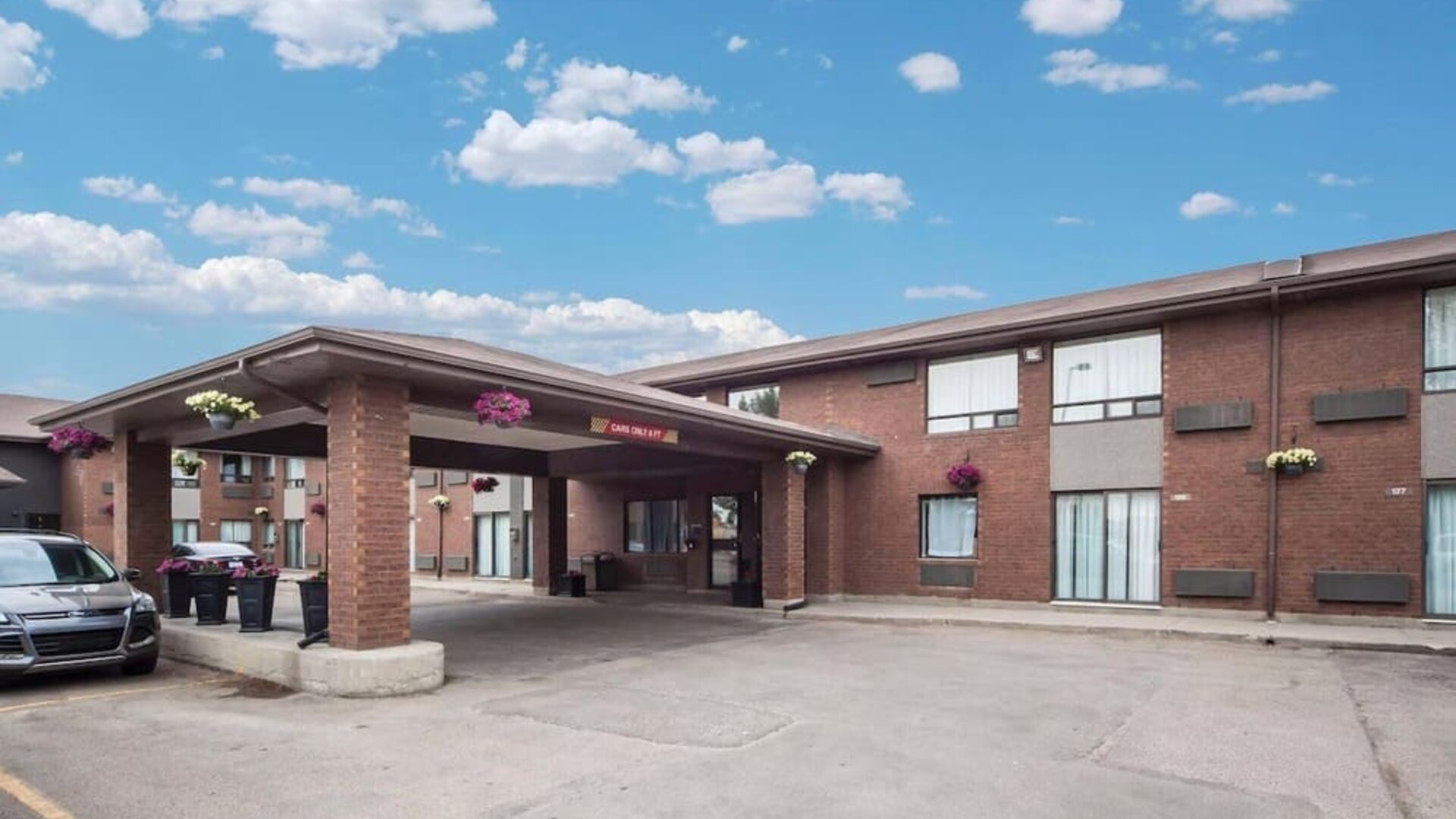 Hotel exterior with covered entrance at Comfort Inn Edmonton West.