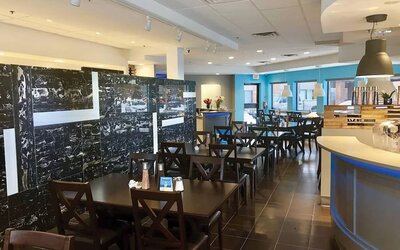 Hotel dining area with tables and breakfast buffet at Comfort Inn Edmonton West.