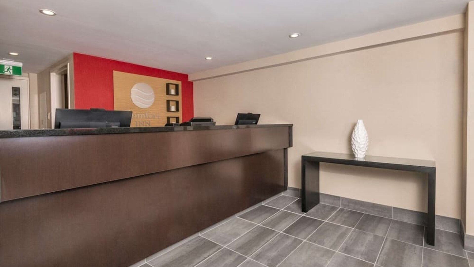 Hotel reception desk at Comfort Inn Ottawa East.