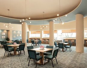 Hotel dining and lounge area with table seating at Sherry Frontenac Oceanfront Hotel.