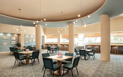 Hotel dining and lounge area with table seating at Sherry Frontenac Oceanfront Hotel.