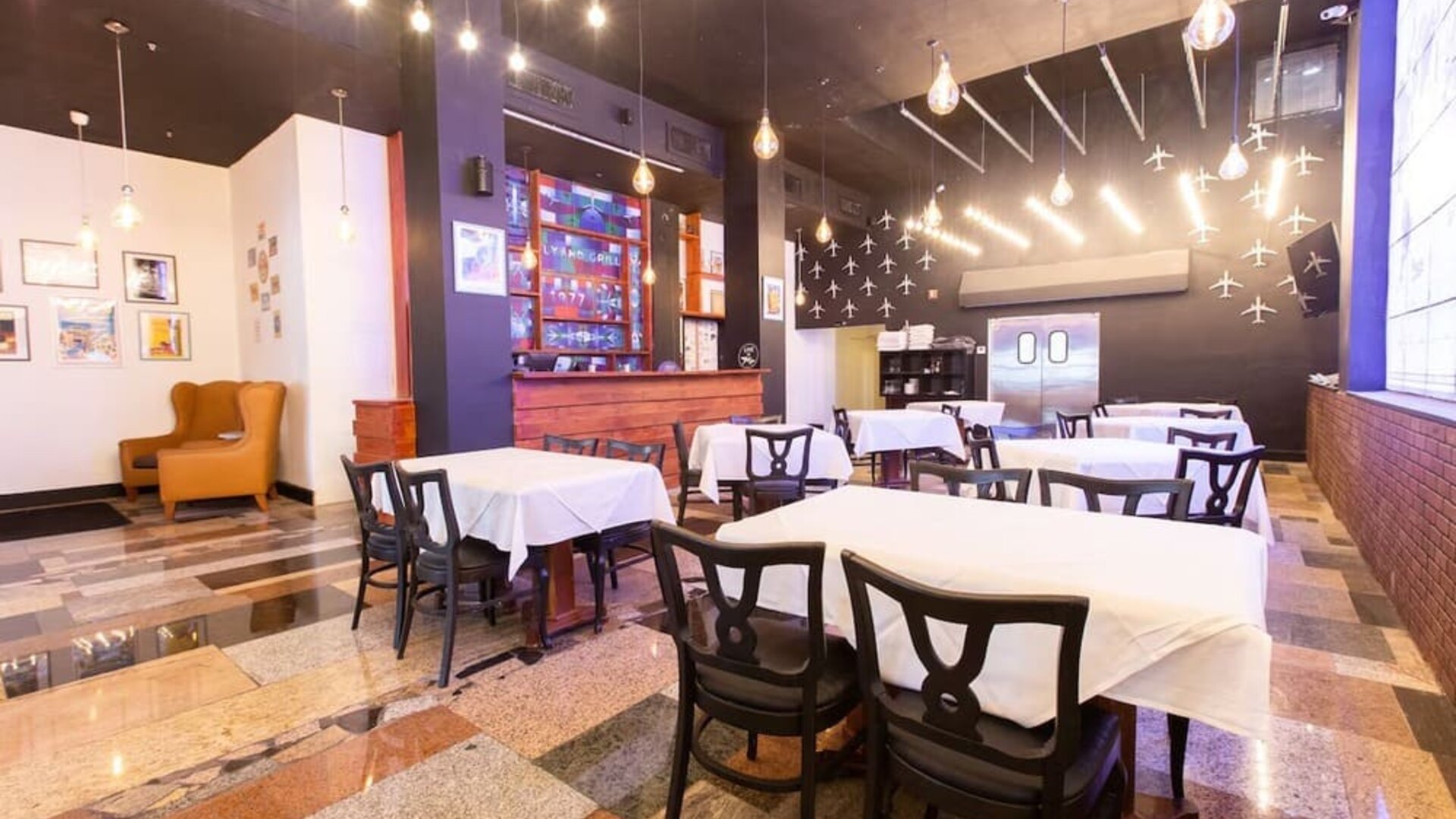 Hotel restaurant with indoor dining tables and ambient lighting at Sherry Frontenac Oceanfront Hotel.