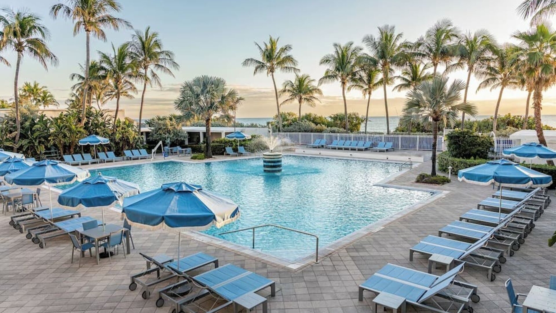 Outdoor swimming pool with sun loungers and ocean views at Sherry Frontenac Oceanfront Hotel.