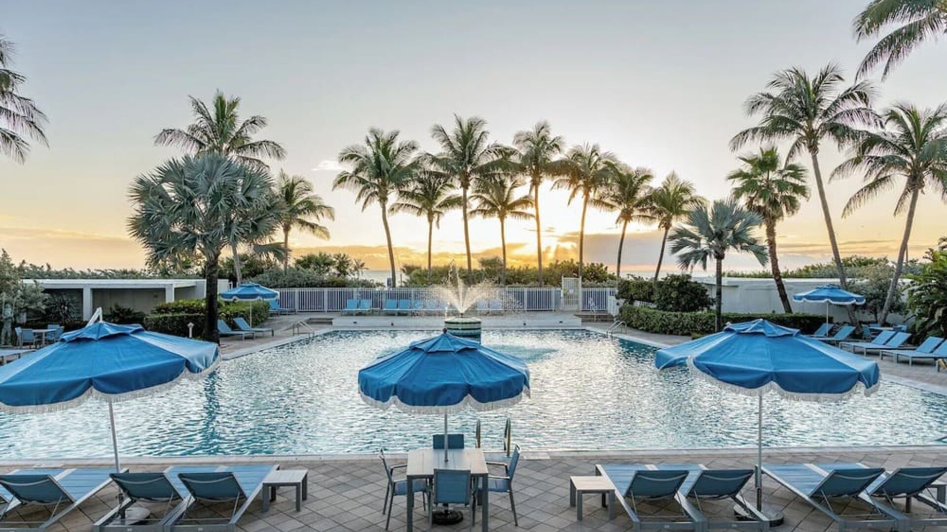 Outdoor swimming pool with lounge chairs and ocean views at Sherry Frontenac Oceanfront Hotel.