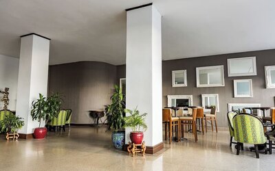 Hotel lounge area with seating and decorative mirrors at Sherry Frontenac Oceanfront Hotel.