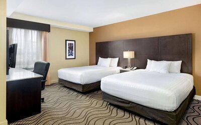 Guest room with two queen beds at La Quinta Inn & Suites By Wyndham Oshawa.