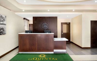Hotel reception desk at La Quinta Inn & Suites By Wyndham Oshawa.