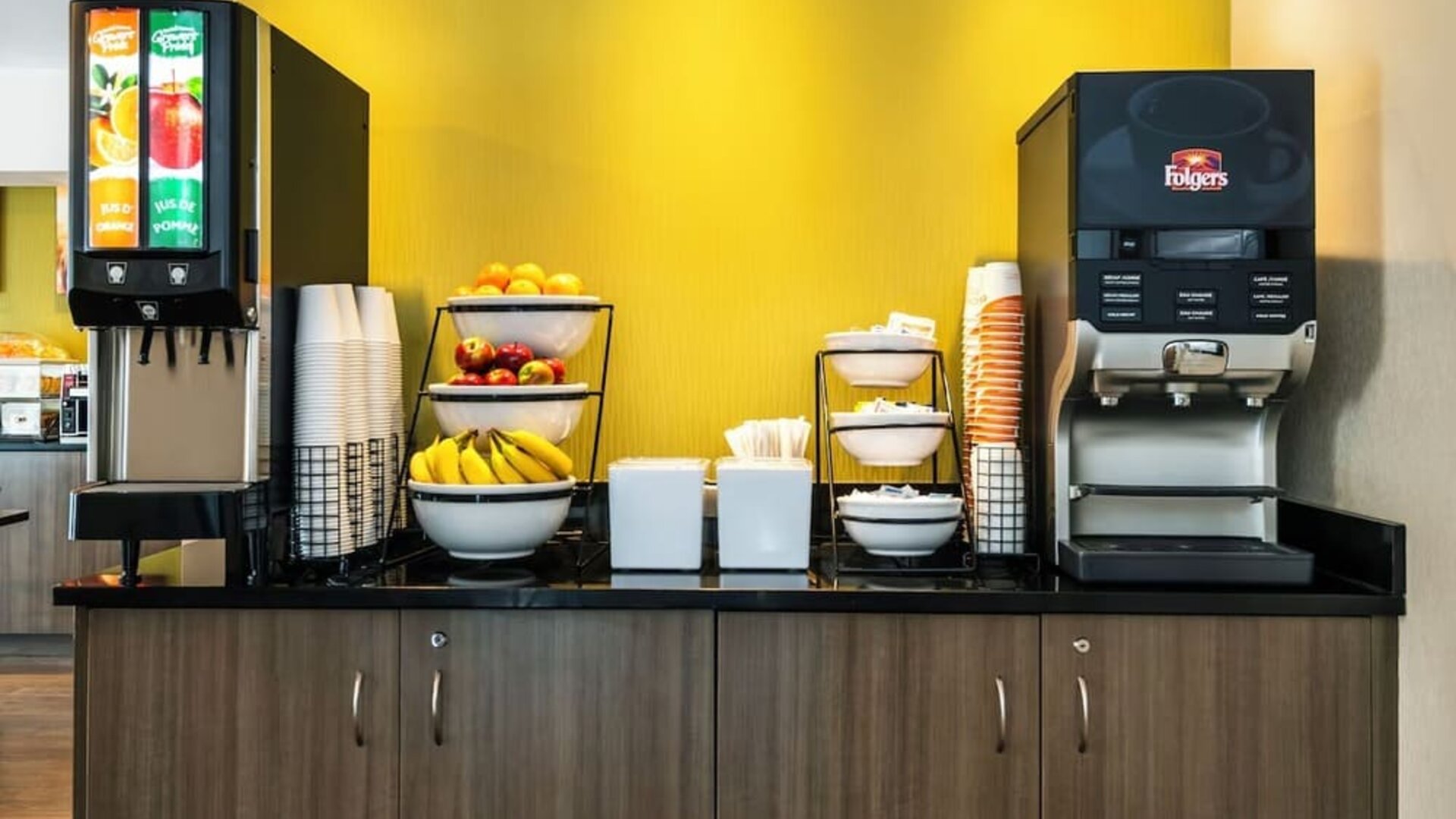 Breakfast station with coffee, juice, and fresh fruit at Comfort Inn Saskatoon.
