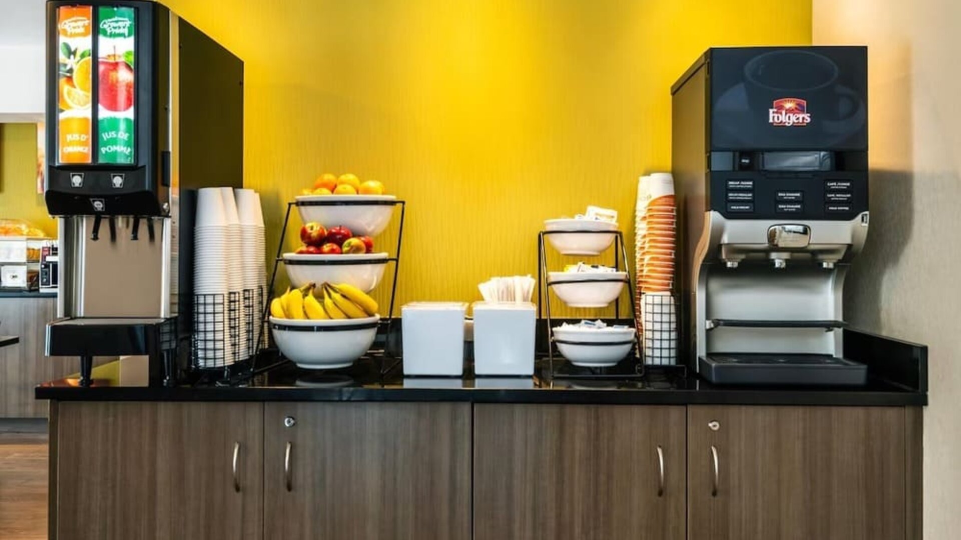 Breakfast station with coffee, juice, and fresh fruit at Comfort Inn Prince Albert.