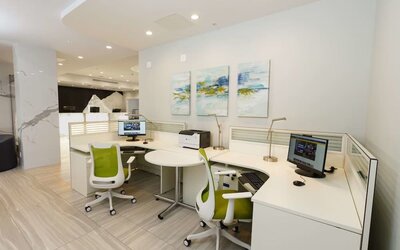 Business center with computers, ergonomic chairs and printer at Executive Residency By Best Western.