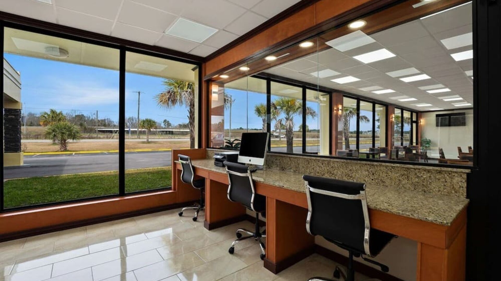 Business center with computer workstations, large windows and roadside views at Quality Inn Yemassee - Point South I-95.