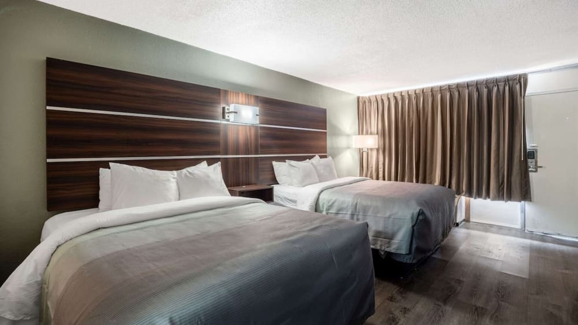 uest room with two double beds, blackout curtains and exterior entry door at Quality Inn Yemassee - Point South I-95.