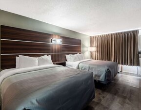 uest room with two double beds, blackout curtains and exterior entry door at Quality Inn Yemassee - Point South I-95.