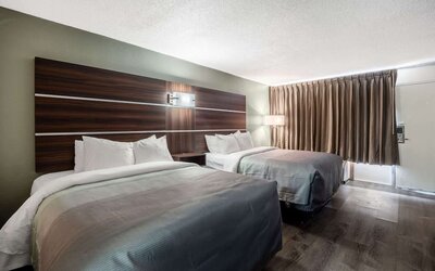 uest room with two double beds, blackout curtains and exterior entry door at Quality Inn Yemassee - Point South I-95.