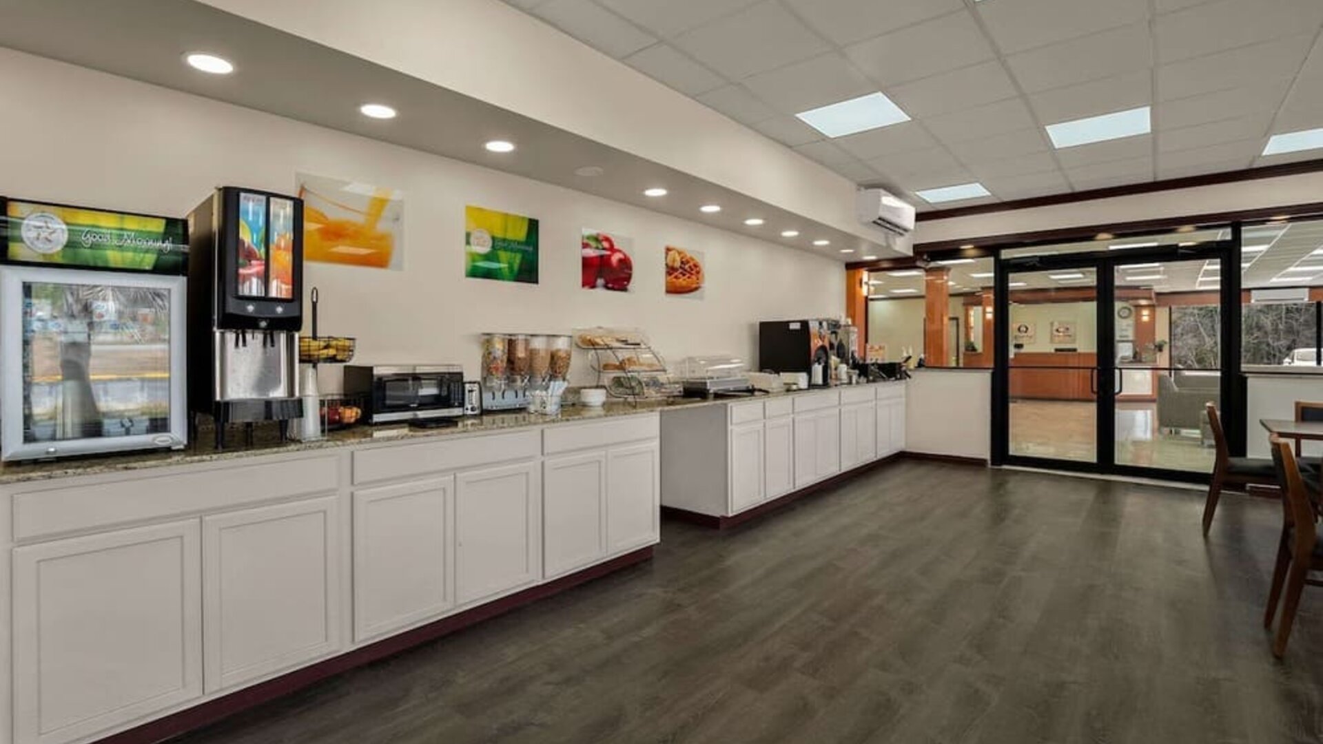 Breakfast buffet with beverage station, cereal dispensers and self-service countertop area at Econo Lodge Yemassee.
