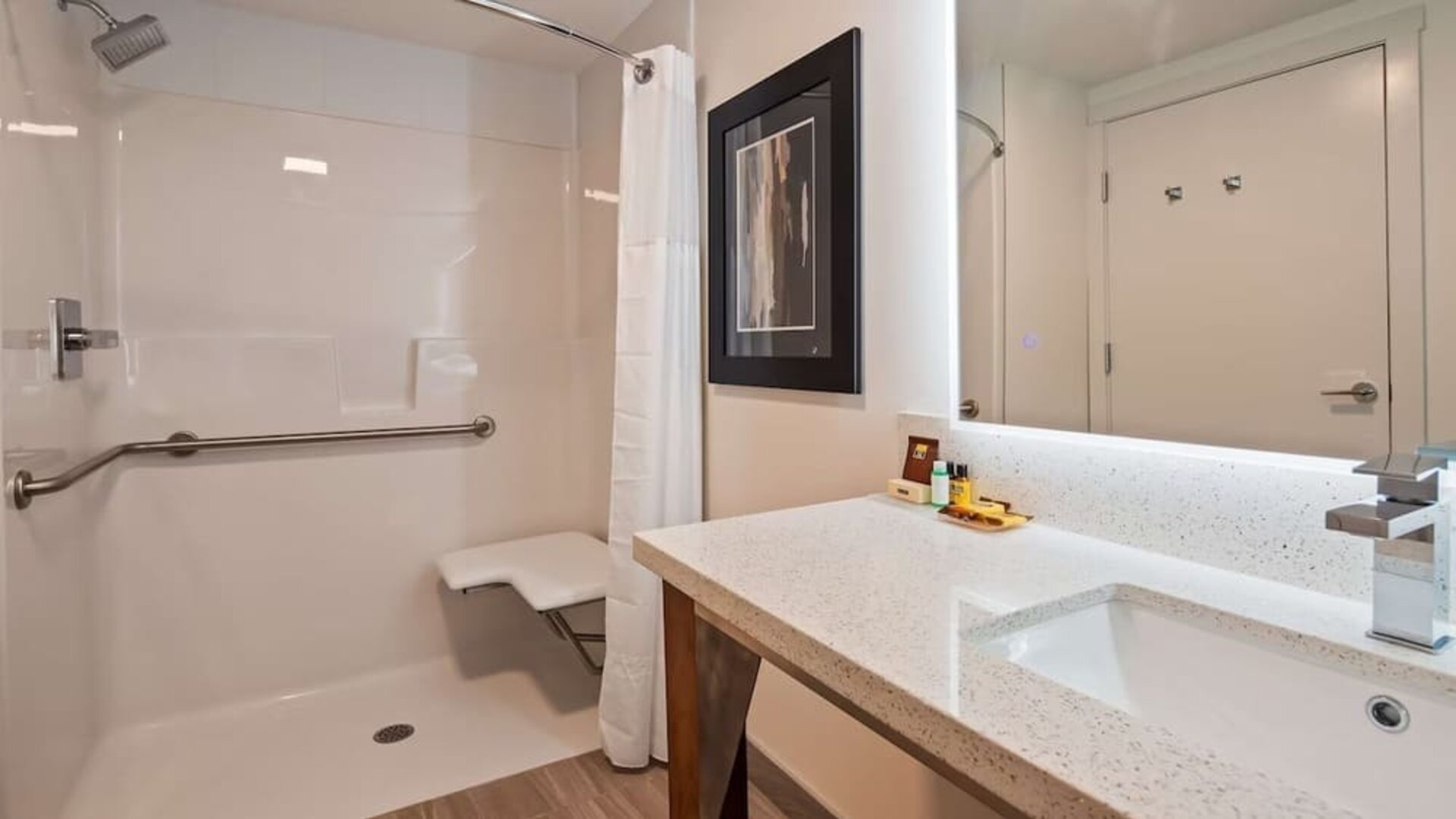 Day use guest bathroom with shower and toiletries at Executive Residency By Best Western.