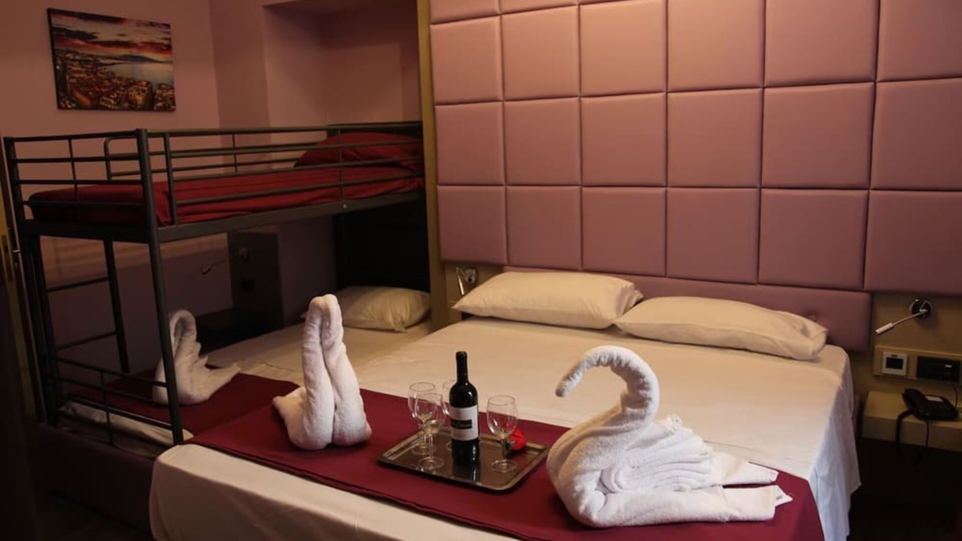 Spacious family room with one double bed, bunk beds and modern amenities at Dolce Vita Rooms & Breakfast.