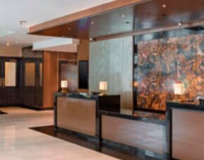 Spacious hotel lobby with contemporary reception area and elegant modern décor at Crowne Plaza Panama.