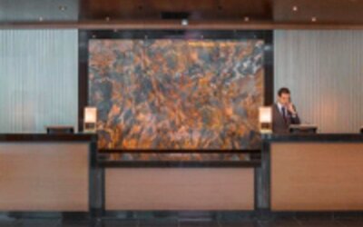 Contemporary hotel reception desk with professional front desk service and elegant lobby design at Crowne Plaza Panama.
