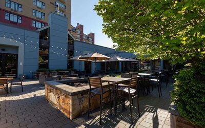 Outdoor bar with lounge area, perfect for co-working at Hilton Whistler Resort & Spa.