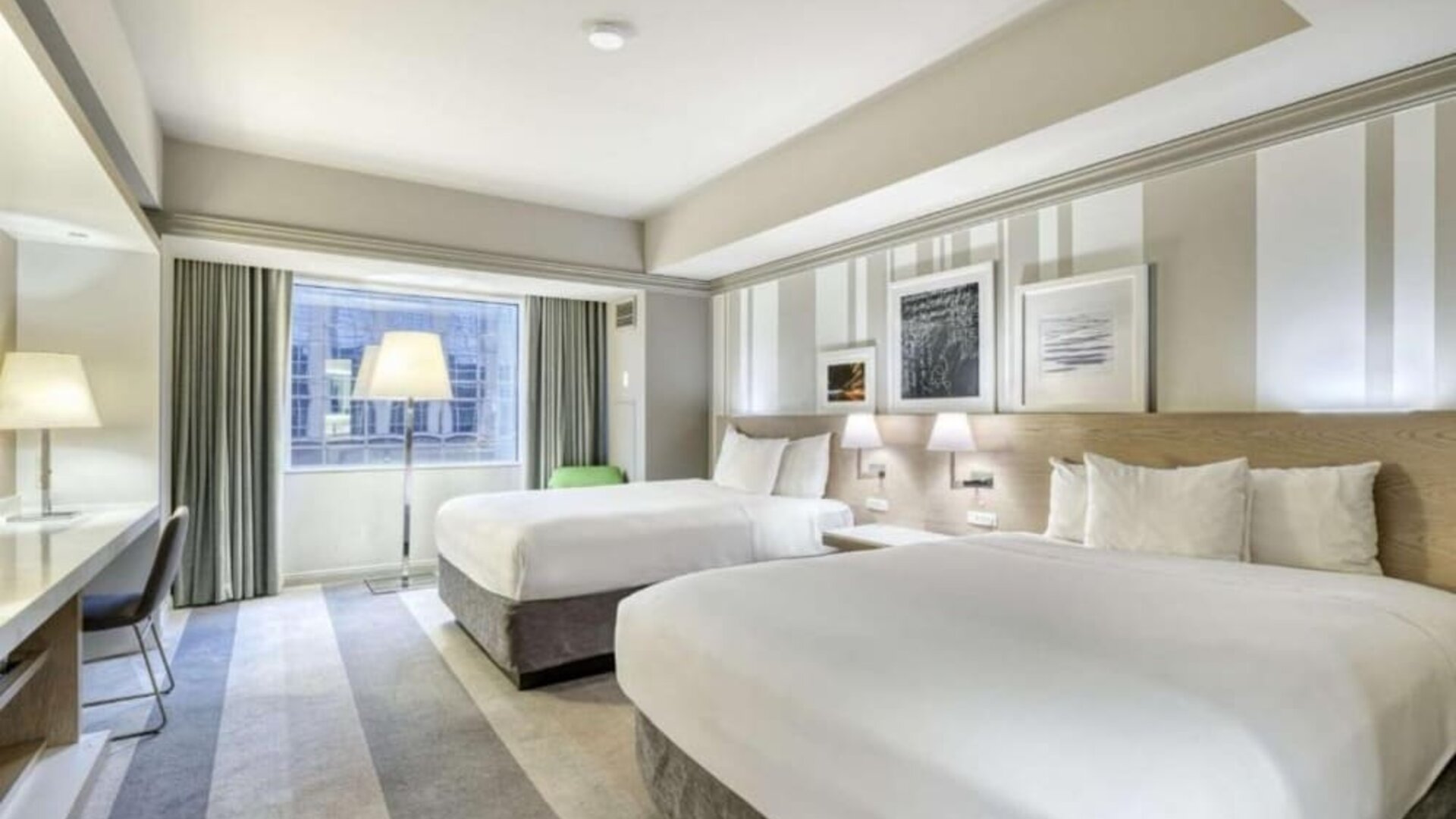 Modern guest room with two queen beds, stylish artwork and a comfortable contemporary design at Royal Sonesta Minneapolis.