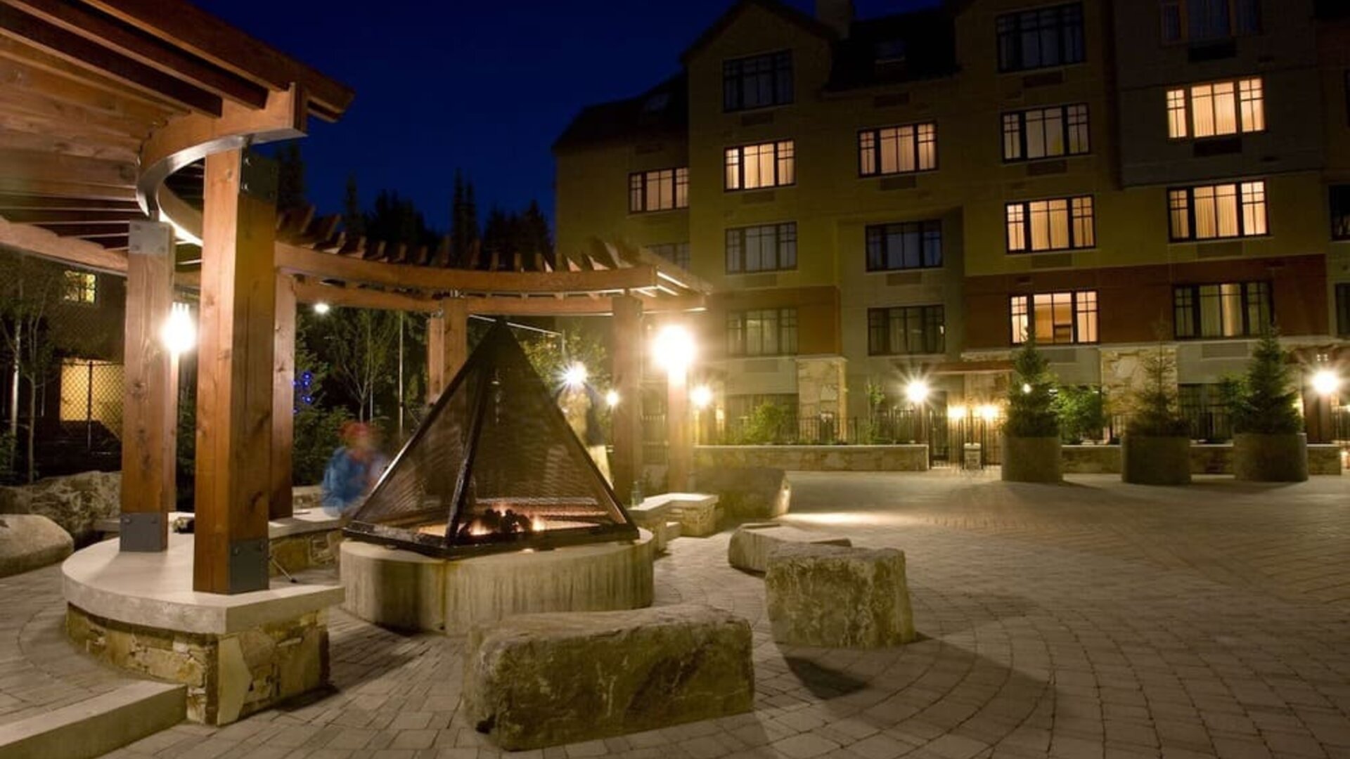 Hotel outdoor with fire place at Hilton Whistler Resort & Spa.