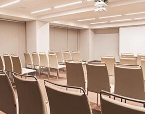 Meeting facility at NH Collection Mexico City Centro Histórico featuring theater-style seating and a large projection screen.