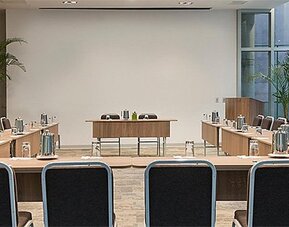 Meeting facility at Holiday Inn Lima Airport featuring U-shaped conference tables, ample seating and presentation space.