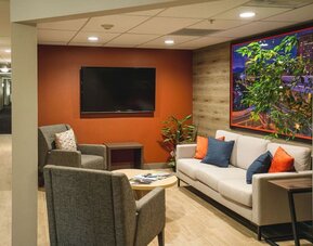 Seating area featuring contemporary furnishings, accent décor and a comfortable space for relaxing or socializing at Candlewood Suites Boise.
