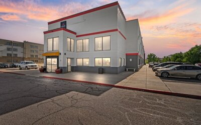 Exterior view of Coratel Inn And Suites By Jasper Wichita North with parking area.