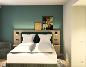Bright modern hotel room with a double bed, crisp white bedding, teal accent wall, bedside reading lights, artwork, and a gray armchair by the window.