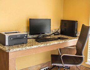 Business centre with desktop computer, printer, work desk, and office chair at Comfort Suites San Antonio SeaWorld - Lackland AFB.