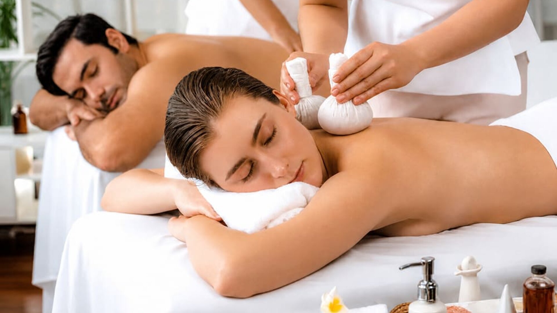 Spa treatment featuring two guests receiving massages in a relaxing treatment setting at SKYLARANNA Resort & Spa.