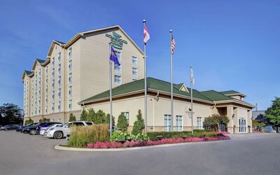Hotel exterior and parking area at Homewood Suites By Hilton Burlington.