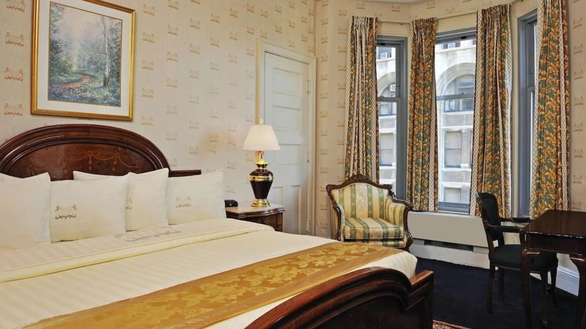 King bedroom with desk at Congress Plaza Hotel.