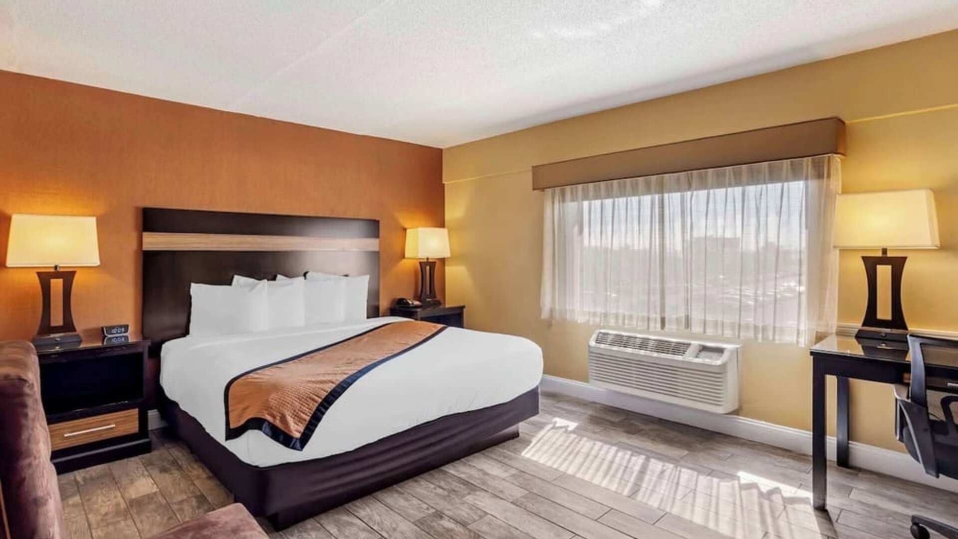 Day use room with sofa and work desk at Best Western Plus Newark Airport West.