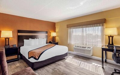 Day use room with sofa and work desk at Best Western Plus Newark Airport West.