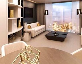 Spacious suite lounge with cream sofas, a dining table, gold decorative accents and panoramic windows at Hotel Las Américas Golden Tower Panamá.