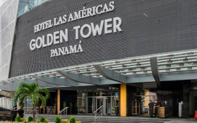 Hotel entrance with a modern canopy, glass doors and the hotel name displayed prominently at Hotel Las Américas Golden Tower Panamá.