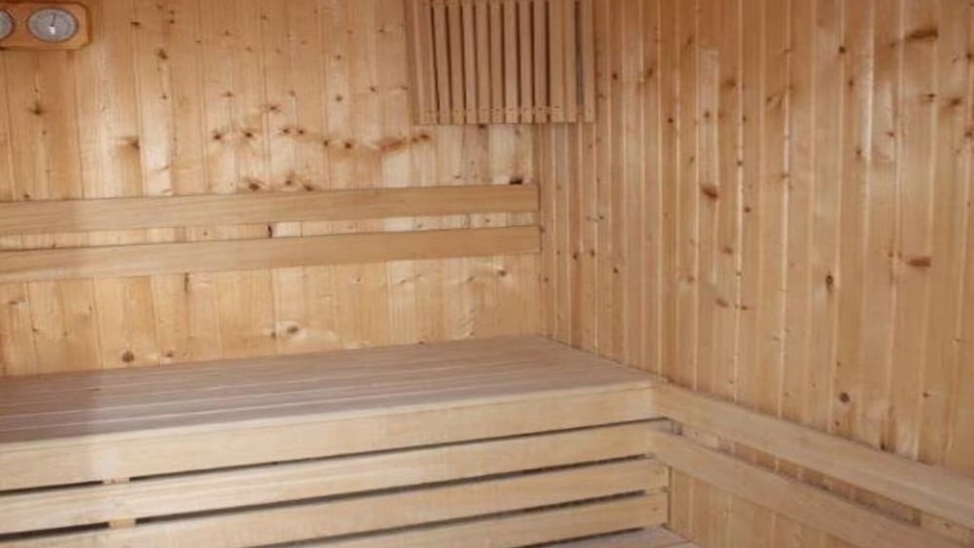 Wooden sauna room with tiered timber benches at Prima Music Eilat.