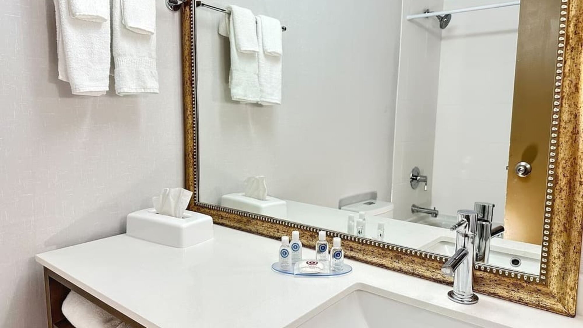 Private guest bathroom with shower and tub at Comfort Inn & Suites Barrie.