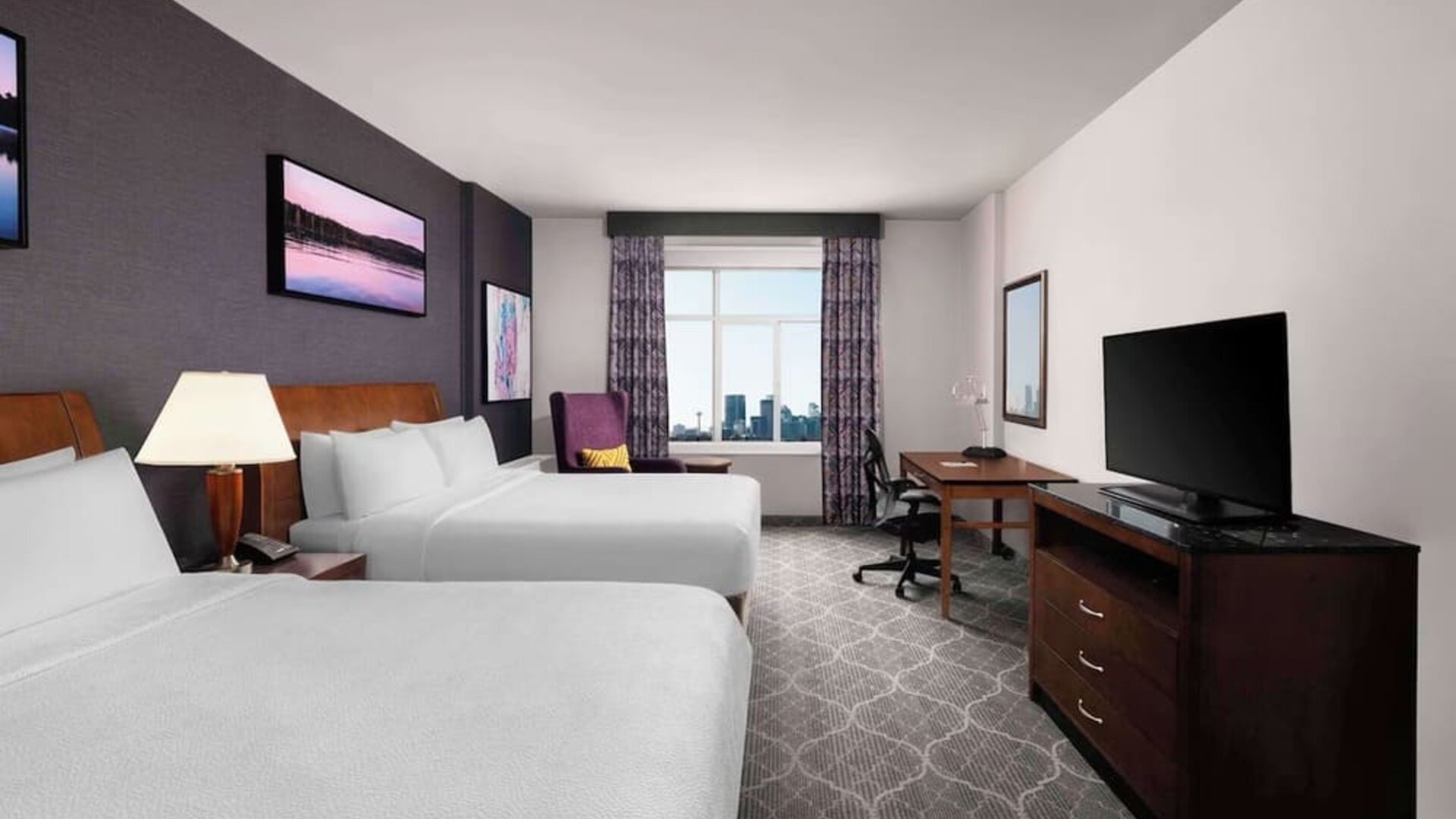 Comfortable twin room with TV, work desk and private bathroom at Hilton Garden Inn Calgary Airport.
