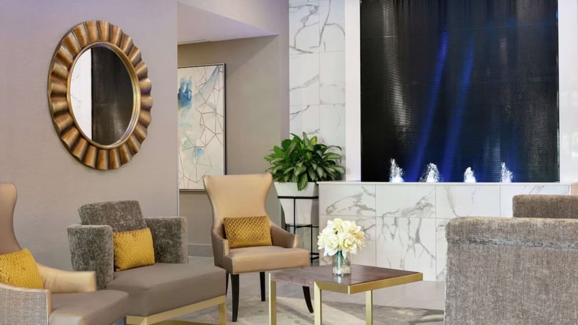 Hotel lobby with lounge area perfect for co-working at the Embassy Suites by Hilton Montreal Airport.