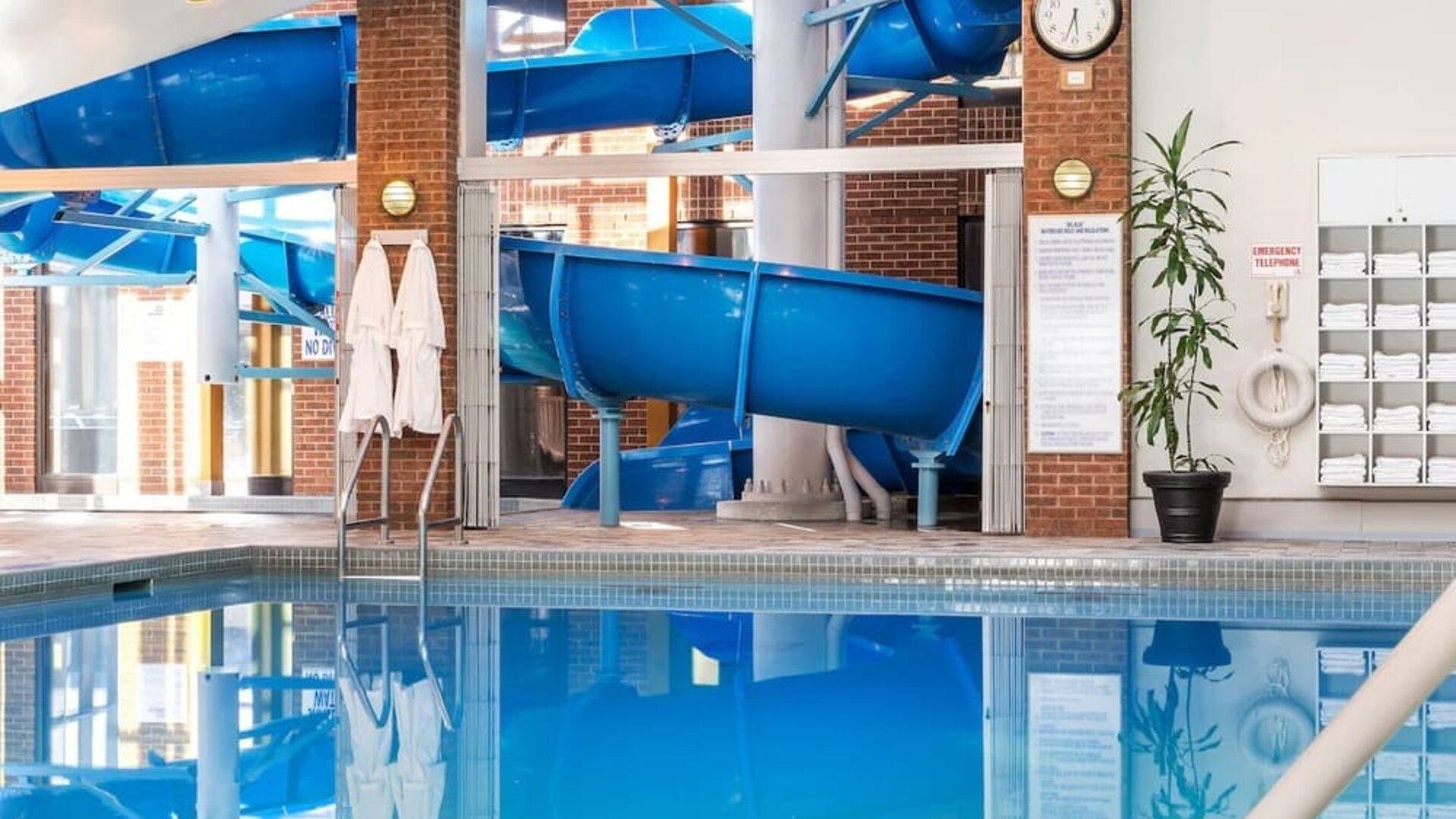 Indoor pool with spiral slide at Hilton Mississauga Meadowvale.