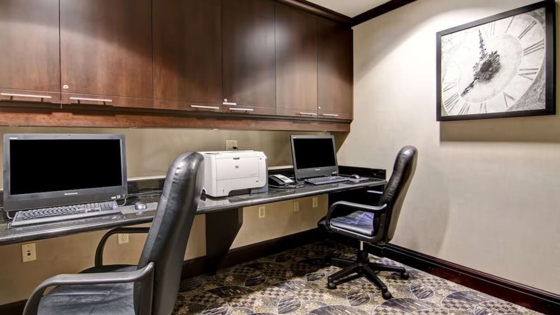 Business center with computers, printer and ergonomic chairs at Hampton Inn By Hilton Toronto Airport Corporate Centre.