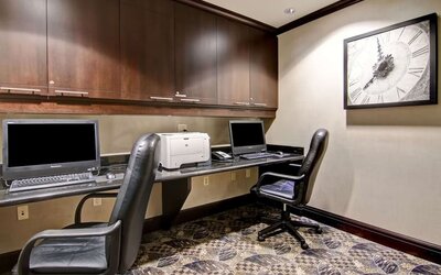 Business center with computers, printer and ergonomic chairs at Hampton Inn By Hilton Toronto Airport Corporate Centre.