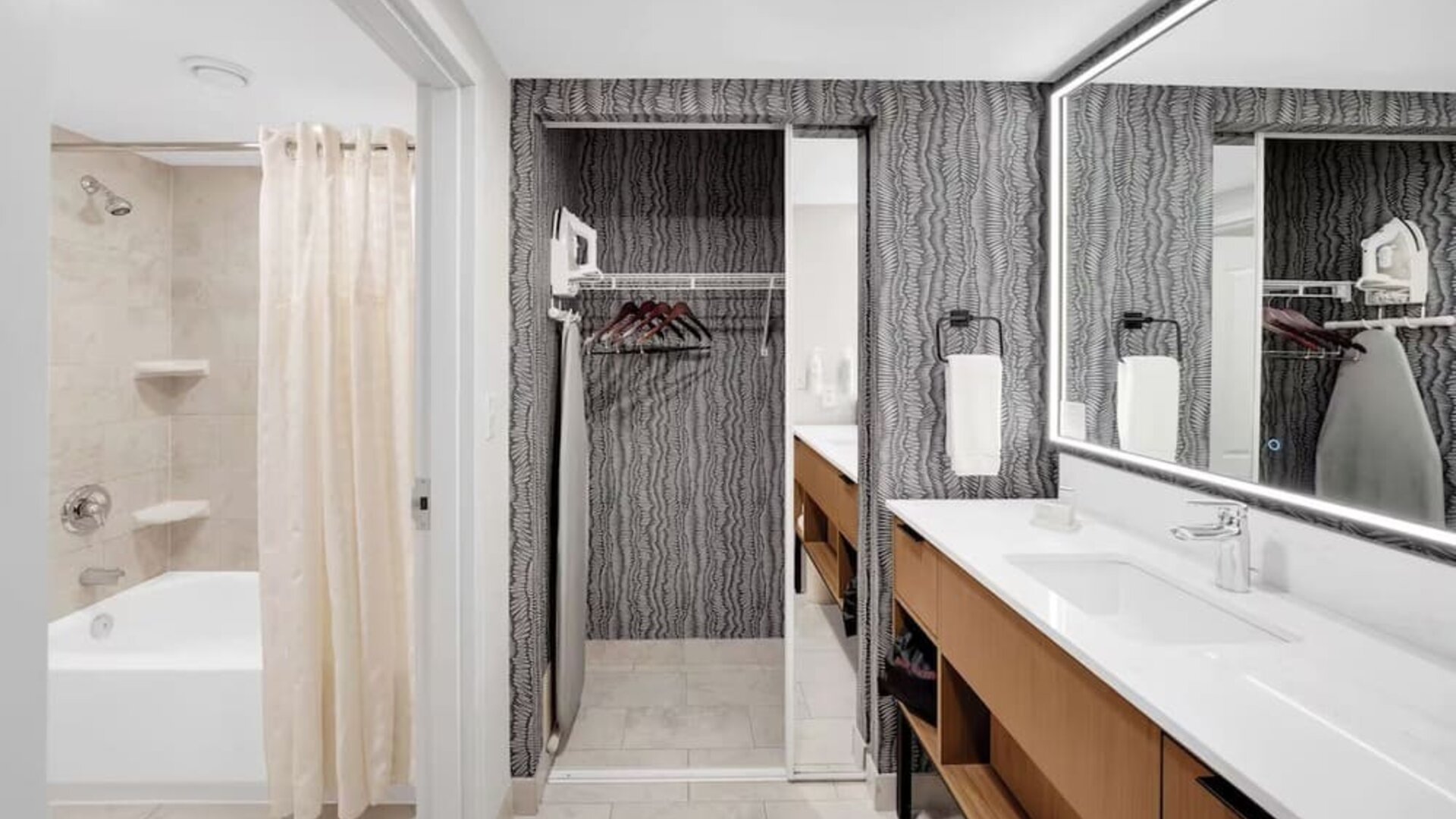 Private bathroom with tub, closet and free toiletries at Homewood Suites By Hilton Toronto-Markham.