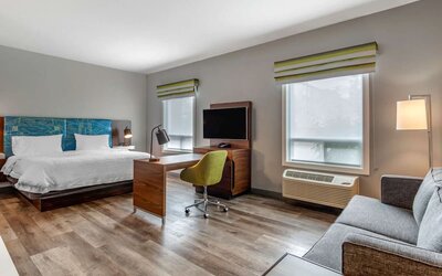 Day use studio suite with lounge area, work station and private bathroom at Hampton Inn & Suites By Hilton Edmonton/West.