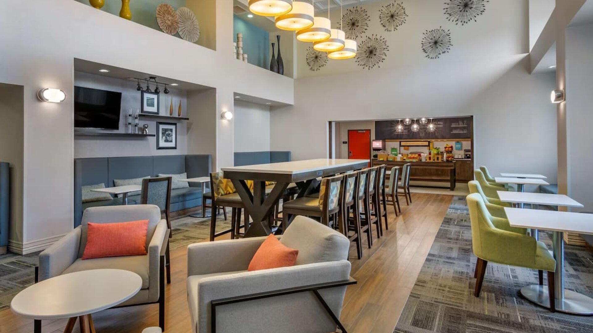Hotel dining area with comfortable seating, perfect for co-working at Hampton Inn & Suites By Hilton Edmonton/West.